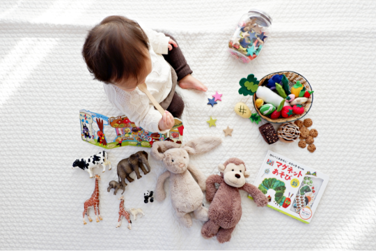 Decorative photo of baby with toys