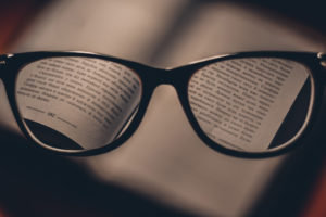 Decorative photo of glasses and text