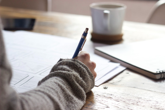 Decorative photo of person writing