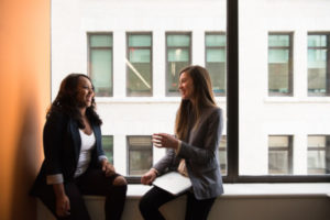 Decorative photo of two professionals having a conversation