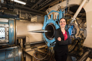 Decorative photo of woman next to machine