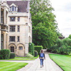 Decorative photo of person walking on campus