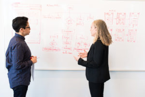 Decorative photo of two researchers in conversation