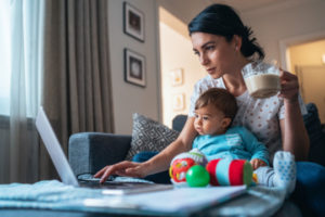 Decorative photo of person working from home with child