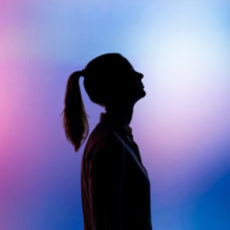 Decorative photo of person's silhouette against multi-coloured background