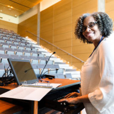 Decorative photo of professor in lecture hall