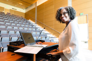 Decorative photo of professor in lecture hall