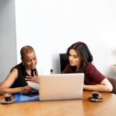 Decorative photo of two people working together