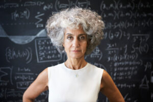 Decorative photo of person looking strong in front of blackboard