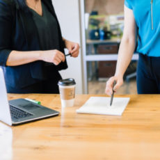 Decorative photo of two people in office