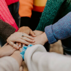 Decorative photo of hands piled together