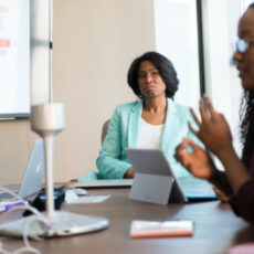 Decorative photo of two people in a meeting