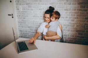 Decorative photo of parent working with child in their arms