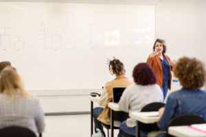 Decorative photo of person giving a lecture