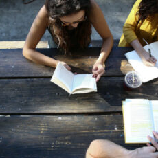 Decorative photo of people reading and journaling