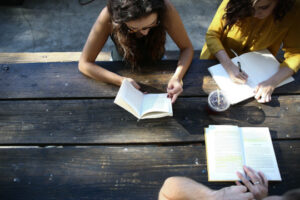 Decorative photo of people reading and journaling