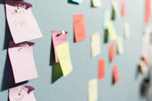 Decorative photo of post-it notes on a wall