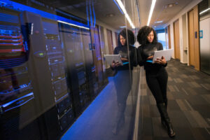 Decorative photo of person next to server rack