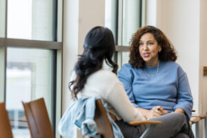 Decorative photo of two people talking