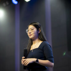 Person standing on stage with mircophone