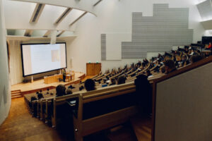 Decorative photo of people in auditorium