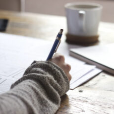 Decorative photo of person doing paperwork