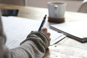 Decorative photo of person doing paperwork