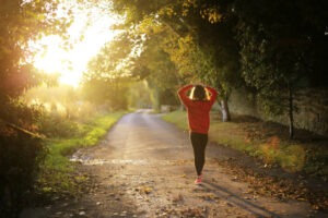 Decorative photo of jogger walking in sunset