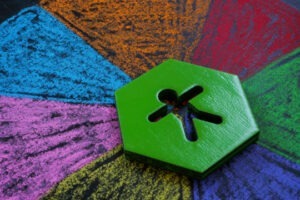 Intersectionality concept. Figurine lies on multi-colored segments.