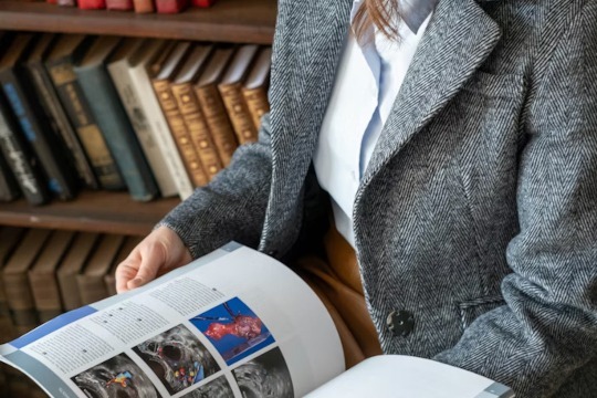 decorative photo of person reading publication