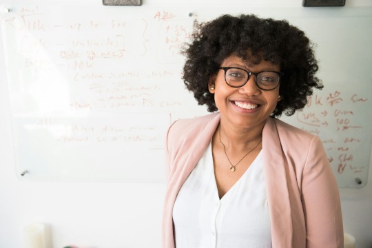 decorative photo of professor in front of whiteboard