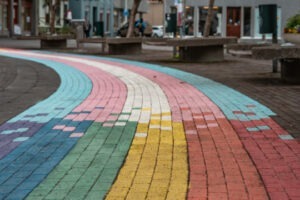 decorative photo of pride and trans flag painted on the streets